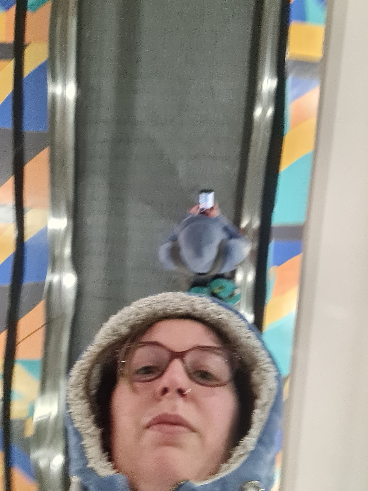 Erica taking a selfie in a mirrored column at Addis Ababa airport